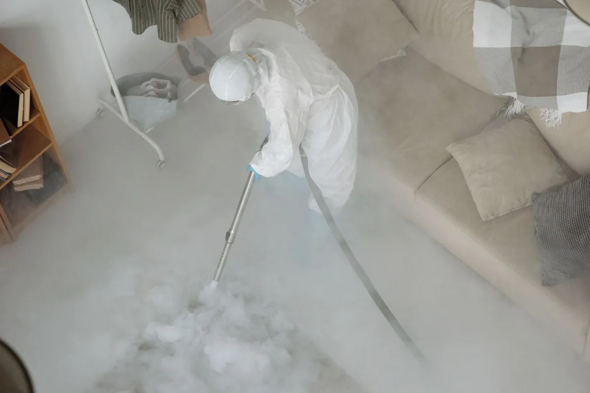 Biohazard cleanup technician in protective equipment, North Beach Haven, NJ